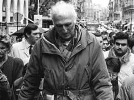 Jean Vanier leading a demonstration in support of people with disabilities.