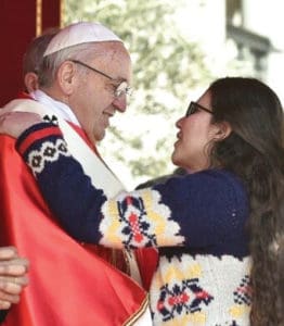 NoemÃ­ SÃ¡nchez, Focolare youth representative from Paraguay, greets Pope Francis during Palm Sunday last year.