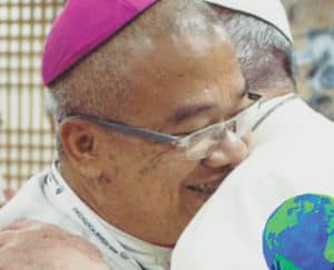 Bishop Alminaza with Pope Francis in a fraternal embrace