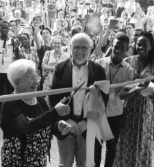 Focolare President Maria Voce cuts the ribbon to inaugurate the restructured auditorium of the Center of the Movement in Rocca di Papa while Co-President Jesús Morán and other members of the Focolare look on.